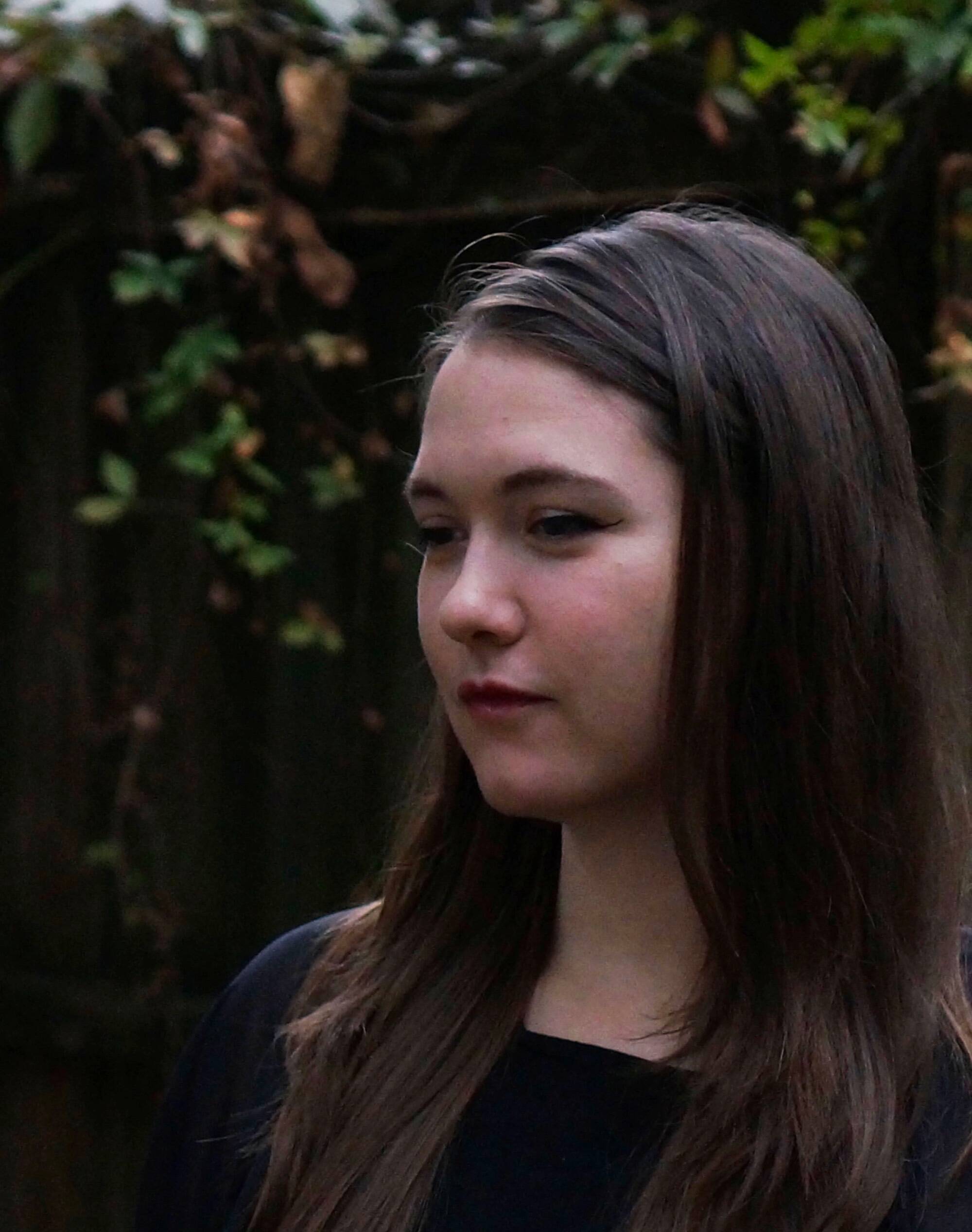 Professor Jane Morton looks over into the distance with a contemplative face.